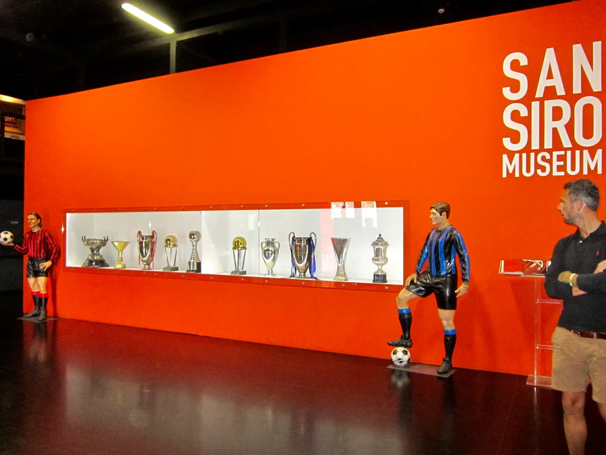 The San Siro Museum entrance wall with the club trophy display inside Stadio Giuseppe Meazza in Milan