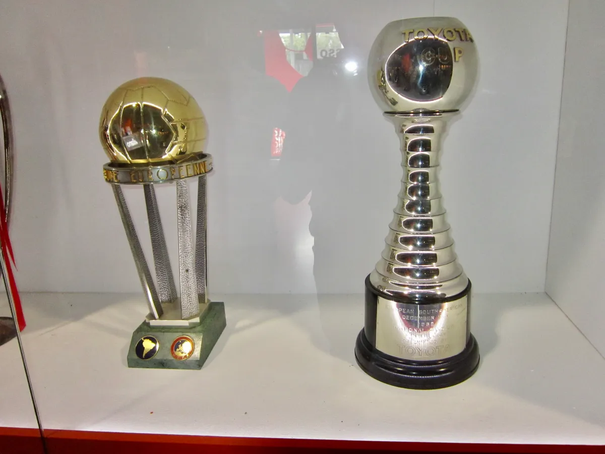 European Cup and Toyota Cup trophies in a display case, part of the indoor route open any time you choose the best time to visit San Siro in Milan