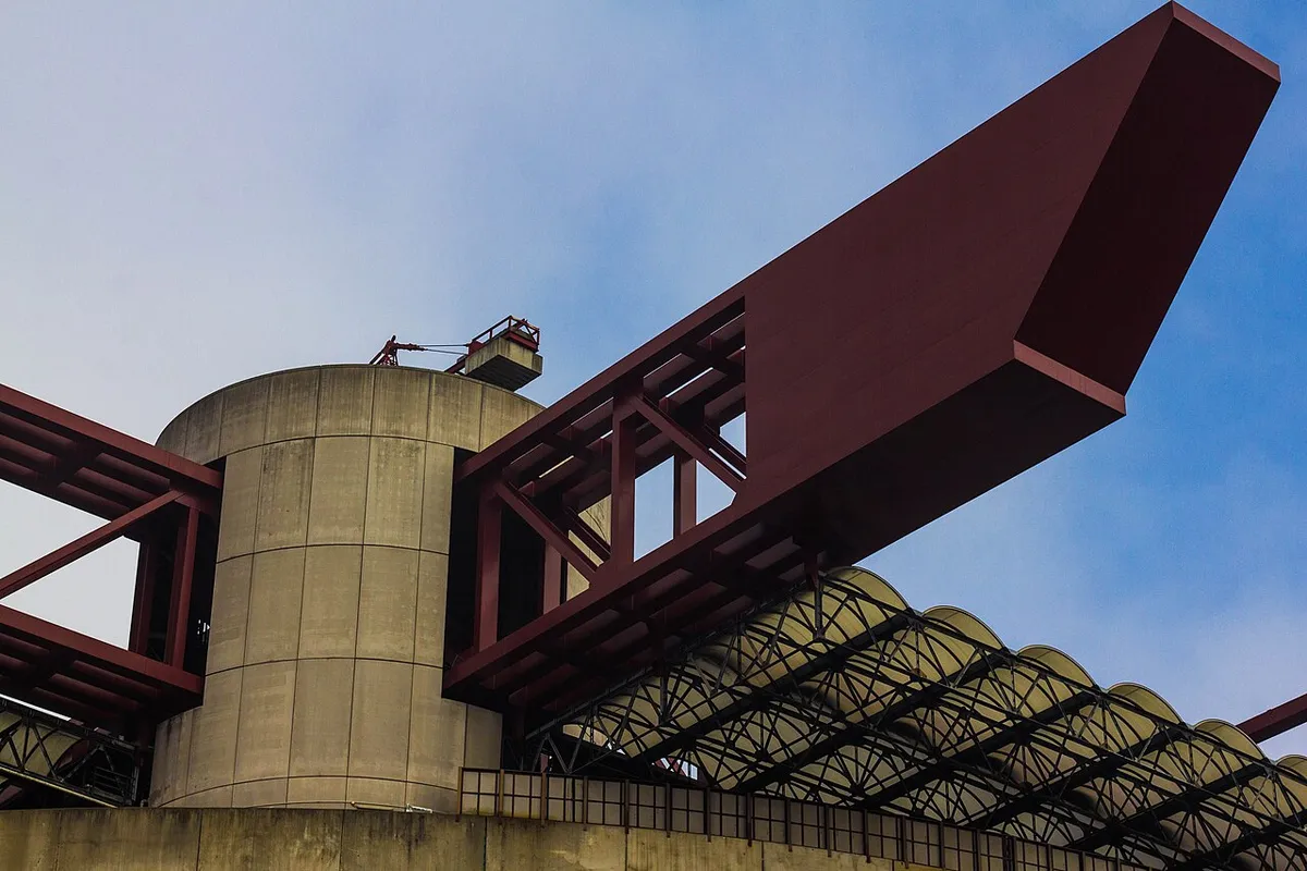 Close-up of San Siro's red roof girders seen on a Milan stadium tour