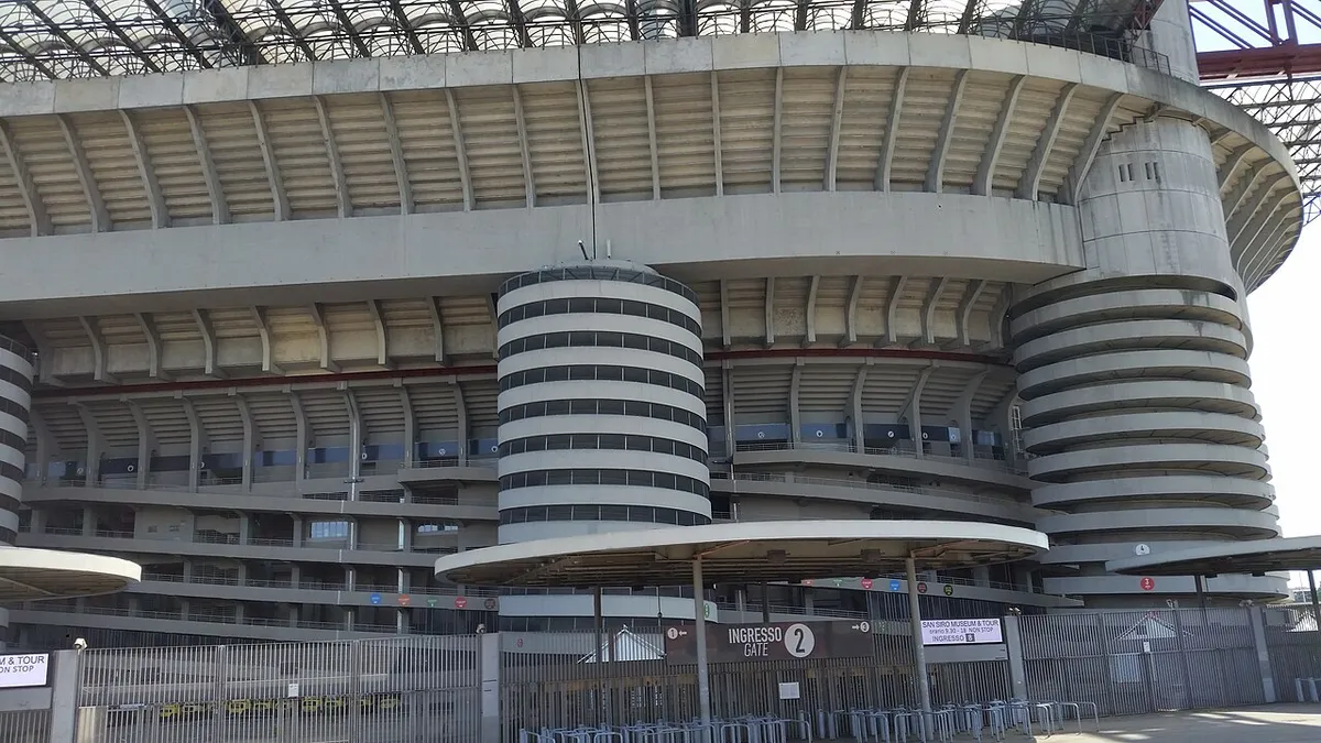 San Siro exterior with a numbered entrance gate on a Milan stadium tour in Italy