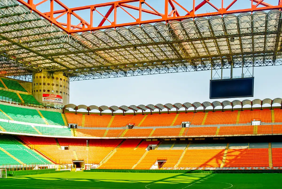 Visitors on a guided walk through the San Siro stands on a Milan stadium tour in Italy